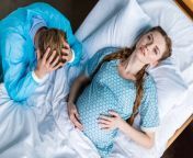 stock photo pregnant woman and man in hospital from pregnant dar