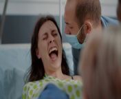videoblocks close up of pregnant woman pushing and screaming in hospital ward at clinic young person giving birth while being in pain caucasian husband supporting wife with contractions and childbirth shgswqha0thumbnail 1080 01.png from wife pegent delivari in hospital