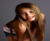 a beautiful young girl posing on a gray background.jpg from xxx beautiful young